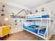 Fun bedroom boasts a bunk bed, playful decorations, and bright lighting at 4594 Terrasonesta Dr, Davenport, FL 33837