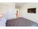 Bedroom featuring a gray comforter, a double door closet, and view of the home at 4594 Terrasonesta Dr, Davenport, FL 33837