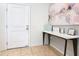 Entryway with white door and console table with tasteful decor on tile flooring at 4594 Terrasonesta Dr, Davenport, FL 33837