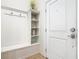 Hallway features built-in shelving, coat hooks, and seating area at 4594 Terrasonesta Dr, Davenport, FL 33837