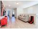 Relaxing living room features a comfortable couch, gaming chair, and plenty of space at 4594 Terrasonesta Dr, Davenport, FL 33837