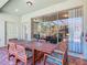 Covered outdoor patio featuring a dining table with seating, perfect for outdoor meals and entertaining at 4594 Terrasonesta Dr, Davenport, FL 33837