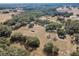 An aerial view of a beautiful vineyard estate, showcasing the lush landscape and serene homes at 5117 Cr 316A, Bushnell, FL 33513