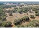 An aerial view of a beautiful vineyard estate, showcasing the lush landscape and serene homes at 5117 Cr 316A, Bushnell, FL 33513
