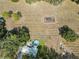 An aerial view of a home and vineyard, showcasing the lush landscape and pool at 5117 Cr 316A, Bushnell, FL 33513