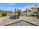 Beautifully landscaped backyard features table and chairs as well as access to an above ground pool at 5117 Cr 316A, Bushnell, FL 33513