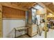 Unfinished basement area featuring exposed wooden beams and mechanical equipment at 5117 Cr 316A, Bushnell, FL 33513