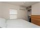 This charming bedroom features a comfortable bed, closet space, and an AC unit for climate control at 5117 Cr 316A, Bushnell, FL 33513