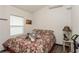 Cozy bedroom with floral bedding and a window for natural light at 5117 Cr 316A, Bushnell, FL 33513