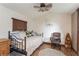 Bedroom features a twin daybed, wood floors, and comfortable seating for relaxation at 5117 Cr 316A, Bushnell, FL 33513