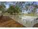 Large concrete pad with views of the home, outbuildings, and lots of trees at 5117 Cr 316A, Bushnell, FL 33513