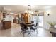 Dining area with a hanging light fixture and french doors leading to the backyard at 5117 Cr 316A, Bushnell, FL 33513