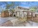 Exterior view of this two-story home with yard and extra storage space at 5117 Cr 316A, Bushnell, FL 33513
