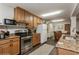 Well-lit kitchen features granite countertops and stainless-steel appliances at 5117 Cr 316A, Bushnell, FL 33513