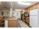 Open-concept kitchen boasts granite counters and stainless steel appliances at 5117 Cr 316A, Bushnell, FL 33513