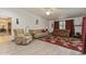Cozy living room features tile flooring, ceiling fan, large windows, and comfortable seating at 5117 Cr 316A, Bushnell, FL 33513