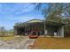 Large open shed structure with equipment, offering ample covered storage for farm machinery and tools at 5117 Cr 316A, Bushnell, FL 33513