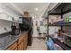 Walk-in pantry provides ample storage with lots of shelving, cabinets, countertop, and refrigerator at 5117 Cr 316A, Bushnell, FL 33513