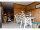 Utility space with plywood walls, open shelving, and stacked chairs, providing ample storage and functional workspace at 5117 Cr 316A, Bushnell, FL 33513