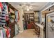Spacious walk-in closet with custom shelving and ample storage space for clothes and accessories at 5117 Cr 316A, Bushnell, FL 33513