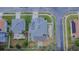 Overhead view of a home with solar panels, a backyard patio, and landscaped lawn at 523 Cascading Creek Ln, Winter Garden, FL 34787