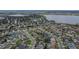 An aerial view of a residential neighborhood close to a lake at 523 Cascading Creek Ln, Winter Garden, FL 34787