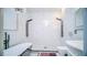 Modern bathroom with a luxurious soaking tub, dual shower heads, and stylish marble finishes at 523 Cascading Creek Ln, Winter Garden, FL 34787