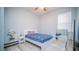 Bright bedroom with neutral walls, ceiling fan, and large window overlooking the outdoors at 523 Cascading Creek Ln, Winter Garden, FL 34787