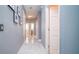Hallway with neutral walls, recessed lighting, and framed wall art at 523 Cascading Creek Ln, Winter Garden, FL 34787