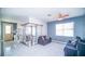 Bright living room featuring recessed lights, sliding doors and open access to the next room at 523 Cascading Creek Ln, Winter Garden, FL 34787