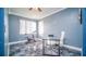 Office with a large window, modern desk, and a tiled floor at 523 Cascading Creek Ln, Winter Garden, FL 34787