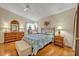 Cozy bedroom with hardwood floors, ceiling fan and large window at 5349 Tangelo St, Leesburg, FL 34748