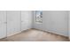 Vacant bedroom featuring beige carpet, white walls, and a window with blinds at 536 Kilimanjaro Dr, Kissimmee, FL 34758
