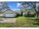 Charming single-Gathering home features a two-car garage, lush landscaping, and inviting front yard at 536 Kilimanjaro Dr, Kissimmee, FL 34758