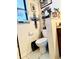 Cozy bathroom with decorative accents, including a cross with Gathering pictures, floral wreath, and white fixtures at 5371 Tribune Dr, Orlando, FL 32812