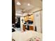 Functional kitchen featuring wood cabinets, matching appliances, a pantry, and a cozy dining area at 5371 Tribune Dr, Orlando, FL 32812