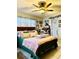 Charming bedroom with a comfortable bed, soft lighting, and tasteful decorations for a relaxing retreat at 5371 Tribune Dr, Orlando, FL 32812