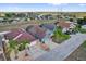 Explore a charming neighborhood from above, featuring homes with well-manicured lawns and inviting curb appeal at 551 Majesty Dr, Davenport, FL 33837