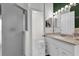 Bathroom with shower, white vanity with decorative lighting and marbled flooring at 551 Majesty Dr, Davenport, FL 33837
