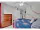 Bedroom featuring baseball themed decor, light walls, and a ceiling fan with light fixture at 551 Majesty Dr, Davenport, FL 33837