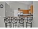 Modern kitchen with a breakfast bar, stainless steel appliances, and ample counter space at 551 Majesty Dr, Davenport, FL 33837