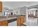 Bright open kitchen showcasing modern appliances, a breakfast bar, and seamless access to the living areas at 551 Majesty Dr, Davenport, FL 33837