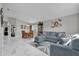 Open living and dining area with tile floors, modern furniture, and a seamless flow for entertaining at 551 Majesty Dr, Davenport, FL 33837