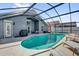 Inviting screened-in pool area with multiple lounge chairs, perfect for outdoor relaxation and entertainment at 551 Majesty Dr, Davenport, FL 33837