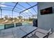 Enjoy outdoor living with a screened-in pool and patio featuring a TV for entertainment by the poolside at 551 Majesty Dr, Davenport, FL 33837