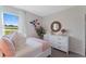 Bright bedroom showcasing a fluffy bed, decorative floral arrangements, and a large window with scenic views at 5852 Galloping Dr, Apopka, FL 32712