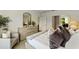Cozy bedroom with natural light, a dresser with mirror, and comfortable chair at 5852 Galloping Dr, Apopka, FL 32712