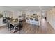 Spacious kitchen with a large island, modern appliances, and adjacent dining area at 5852 Galloping Dr, Apopka, FL 32712