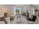 Inviting living room with a large window, comfortable seating, and stylish decor at 5852 Galloping Dr, Apopka, FL 32712