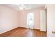 Bedroom featuring laminate flooring, a window, and neutral paint at 600 Marion Oaks Blvd, Ocala, FL 34473